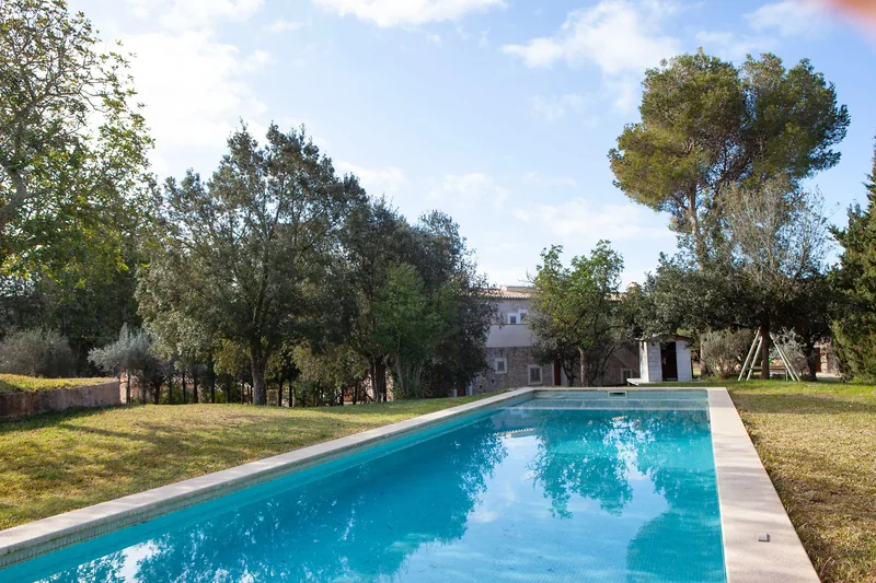 Swimming pool at S'Hort de Sa Begura surrounded by garden